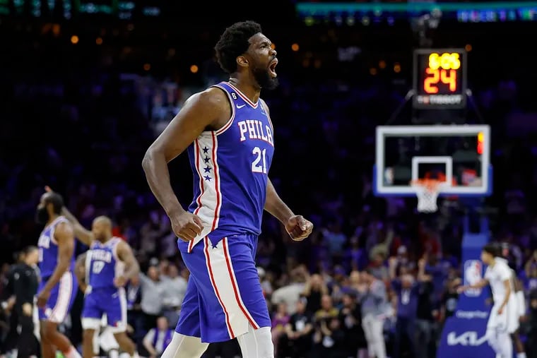 Sixers center Joel Embiid celebrates after Tobias Harris sinks a three-pointer in the third quarter of their Game 2 win over the Brooklyn Nets.