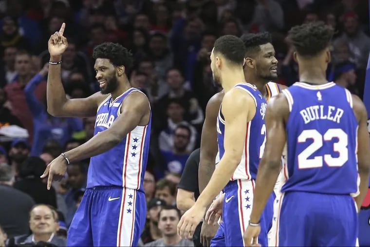 Joel Embiid celebrates his basket and foul on the Suns during the third quarter of the Sixers' 119-114 win Monday night at the Wells Fargo Center.