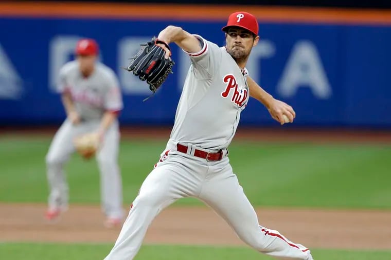 Phillies' Cole Hamels delivers pitch during first inning. (Associated Press)