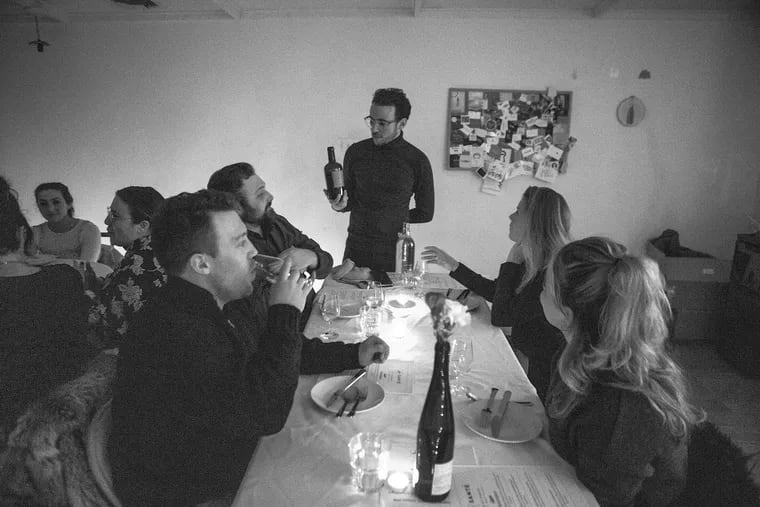 “Don’t run around frantically asking if people are having a good time — be in the moment. Embrace the chaos," says sommelier Daniel Solway (center, holding wine bottle).