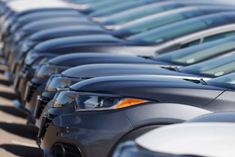 This June 7 photo shows a long row of unsold cars at a Honda dealership in Highlands Ranch, Colo.