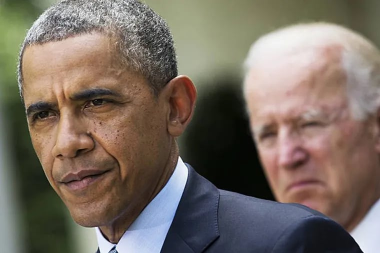FILE - This June 30, 2014 file photo shows President Barack Obama, accompanied by Vice President Joe Biden, pausing while making a statement about immigration reform, in the Rose Garden of the White House in Washington. (AP Photo/Jacquelyn Martin, File)