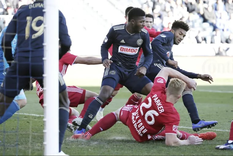 Mark McKenzie (center) is one of three Philadelphia Union players on the U.S. under-20 men's soccer team's squad for Concacaf's World Cup qualifying tournament.