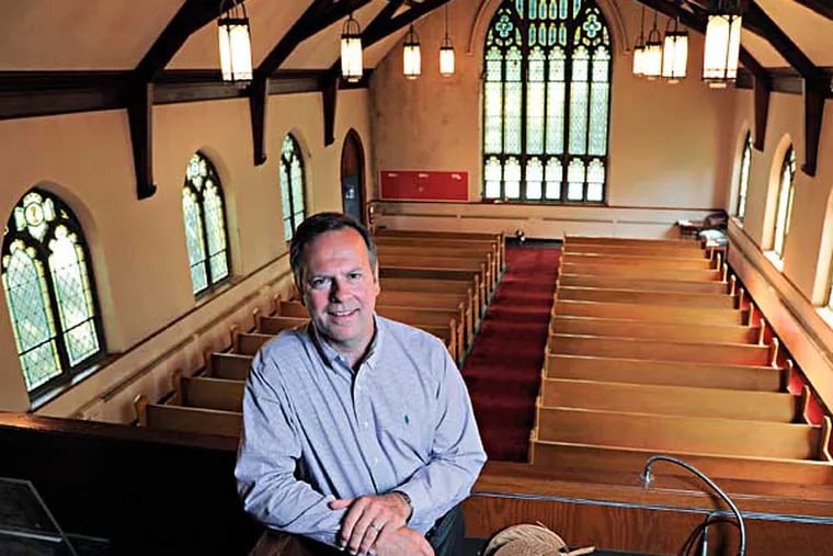 D. Scott Brehman, 51, a partner in Main Line reBUILD, is in the choir loft of an old Baptist Church in Ardmore which his company is going to repurpose into four housing units each about 2500 square feet.  Photo taken July 30, 2014.  ( CLEM MURRAY / Staff Photographer )