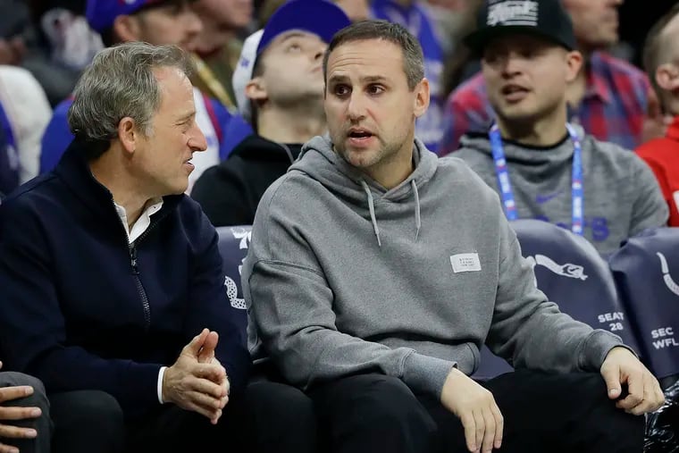 Former Sixers partner Michael Rubin (right) with managing partner Josh Harris court-side at a game.