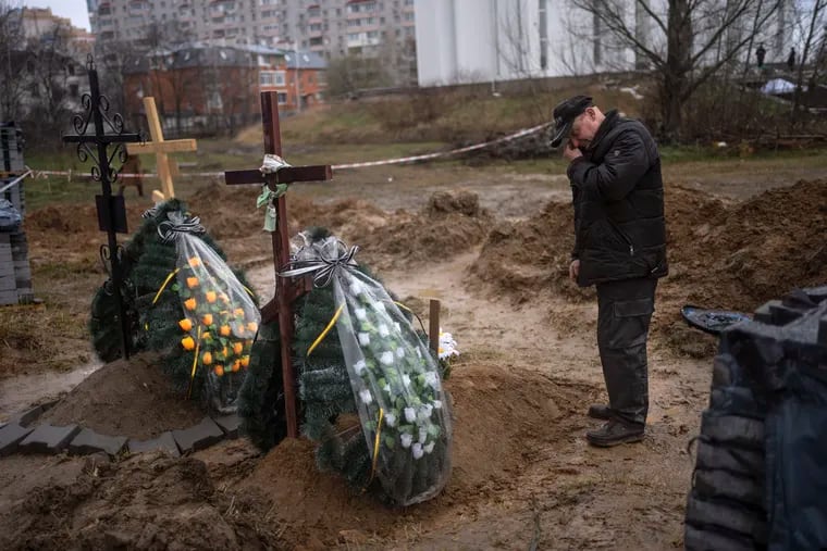 Oleg, 56, mourning for his mother, Inna, 86, killed during the war against Russia in Bucha, on the outskirts of Kyiv, Ukraine, on Sunday.