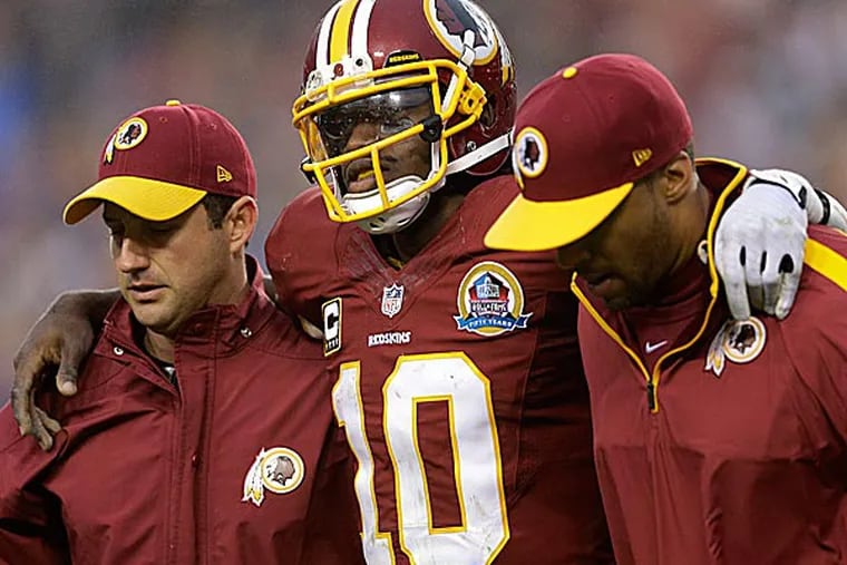 Robert Griffin III went through a regular full practice with first-team receivers for the first time since spraining his right knee. (Patrick Semansky/AP file photo)
