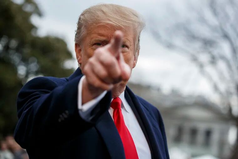 President Donald Trump talks with reporters before boarding Marine One on the South Lawn of the White House, Friday, March 22, 2019, in Washington. (AP Photo/Evan Vucci)