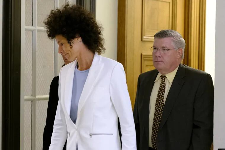 Andrea Constant leaves the courtroom after a mistrial was declared in the Cosby sexual assault trial.