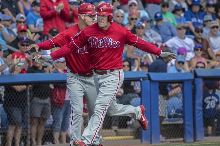 Rhys Hoskins, right, believes the Phillies are a confident team heading into the new season.