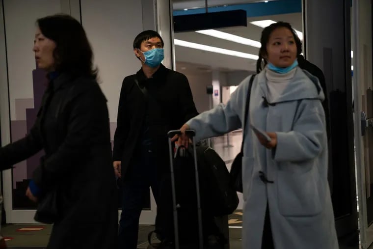 Passengers from United flight UA850 direct from Beijing arrive at Terminal 5 at O'Hare International Airport on Friday, Jan. 24, 2020. The U.S. Centers for Disease Control and Prevention is urging against all nonessential travel to the region, where more than 100 people have died from a deadly coronavirus. (E. Jason Wambsgans/Chicago Tribune/TNS)