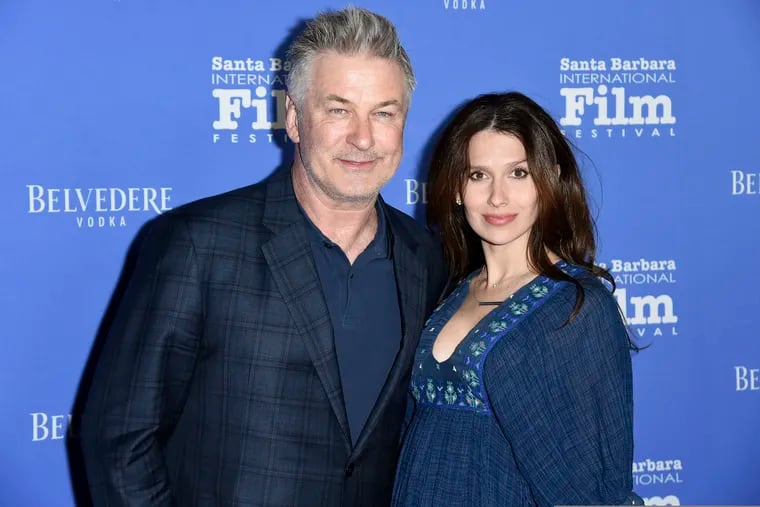 FILE - This Jan. 31, 2018 file photo shows Alec Baldwin, left, and Hilaria Baldwin at the Santa Barbara International Film Festival in Santa Barbara, Calif. Baldwin says he fell for a scam Statue of Liberty tour where he says he bought $40 tickets for a boat tour of the Statue of Liberty for his family but was instead escorted to a shuttle bus to New Jersey. He says his family ultimately ended up taking the Staten island Ferry, which is free and passes the Statue of Liberty. (Photo by Richard Shotwell/Invision/AP, File)
