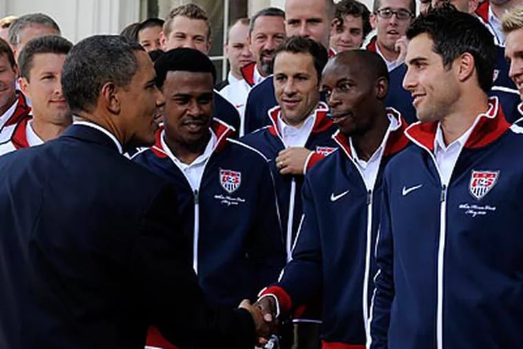President Barack Obama greets members of the U.S. World Cup soccer team at the White House. (AP Photo/Susan Walsh)