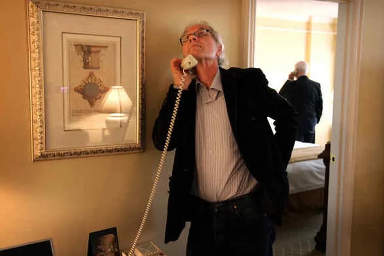 Lars Vilks and Lars Hedegaard (rear), president of the Danish Free Press Society, are interviewed on a Canadian radio show by telephone from their Philadelphia hotel room. Vilks' local appearance was canceled over security concerns.