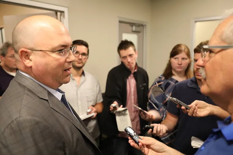With the junior leagues and tournaments shut down by the coronavirus outbreak, Flyers assistant general manager Brent Flahr (left), shown addressing the media last year, and his scouting staff are watching lots of videos of this year's draft prospects.