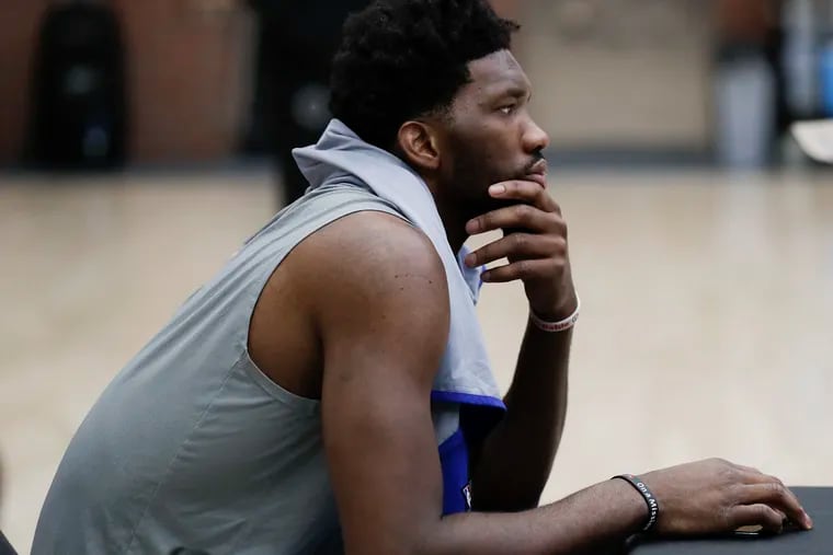 Sixers center Joel Embiid waits to meet with the media before the start of team practice inside Lavietes Pavilion at Harvard University on Tuesday, May 1, 2018. YONG KIM / Staff Photographer