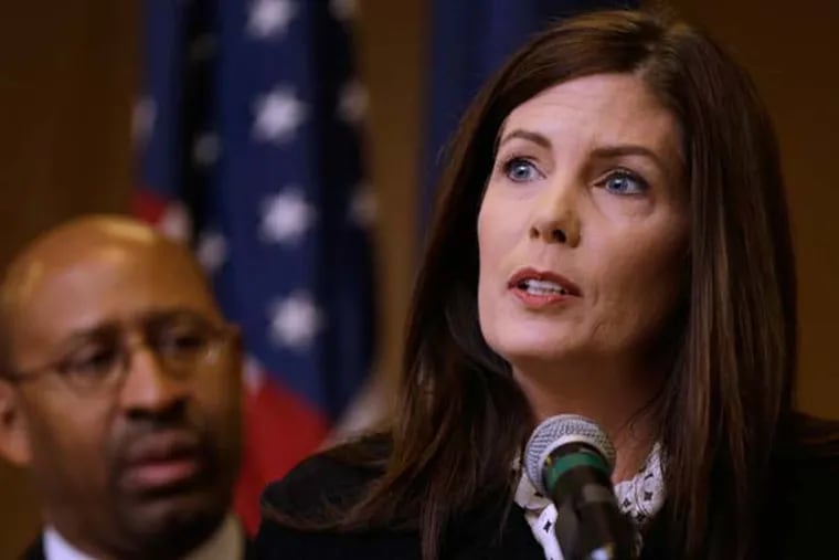 Pennsylvania Attorney Gen. Kathleen Kane, accompanied by Philadelphia Mayor Michael Nutter, speaks during a news conference Friday, Feb. 8, 2013, in Philadelphia, as she announces that Pennsylvania officials are closing a gun-law loophole that lets residents get permits online from Florida, sometimes when they can't get them at home. (AP Photo/Matt Rourke)
