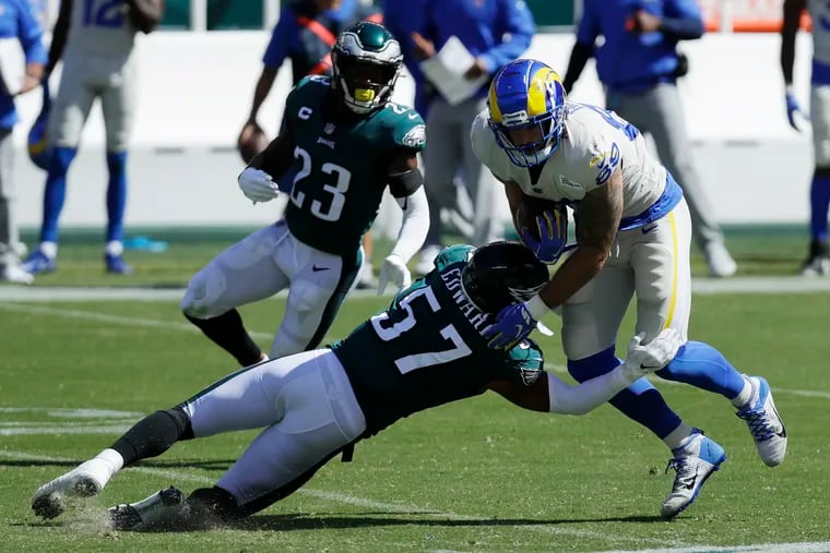 Eagles linebacker T.J. Edwards brings down Los Angeles Rams tight end Tyler Higbee during the first half.