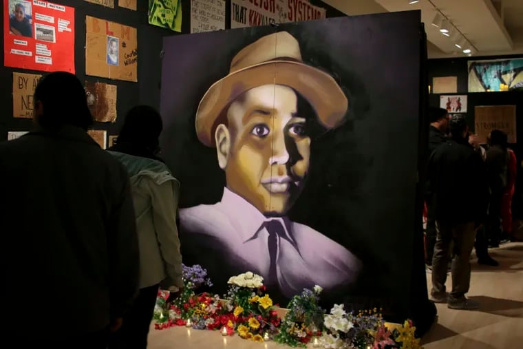 A painting of Emmett Till is displayed at a new exhibit, "Twin Flames: The George Floyd Uprising from Minneapolis to Phoenix," at Arizona State University Art Museum, in Tempe, Arizona on Friday, Feb. 2, 2024. For months after George Floyd was killed by police in May 2020, people from around the world traveled to the site of his murder in Minneapolis and left signs, paintings and poems to memorialize the man whose death reignited a movement against systemic racism. Now hundreds of those artifacts are being displayed at an exhibit at the Arizona State University Art Museum. (AP Photo/Cheyanne Mumphrey)