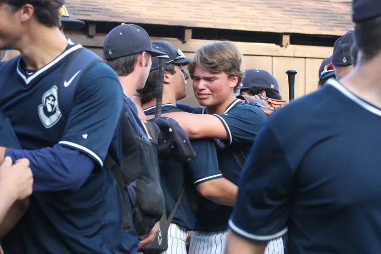 St. Augustine's Rob Ready (center) is consoled by teammates after the Hermits' 4-3 loss to Delbarton in the Non-Public A state final.