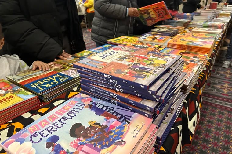 People browse the tables of books at the Pennsylvania Convention Center for the 32nd annual African American Children's Book Fair on Saturday.