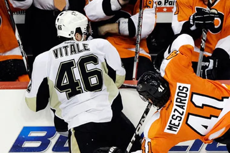 Joe Vitale delivered the hits that knocked Danny Briere and Nick Grossmann out of Sunday's game. (AP Photo/Matt Slocum)