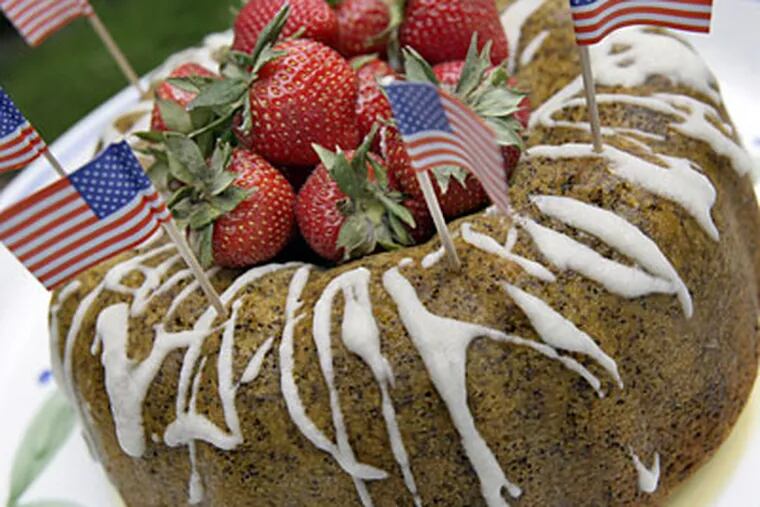 "In Flanders Field" Poppy Seed Cake With Lemon Glaze and Strawberries is especially fitting for a traditional memorial Day picnic.