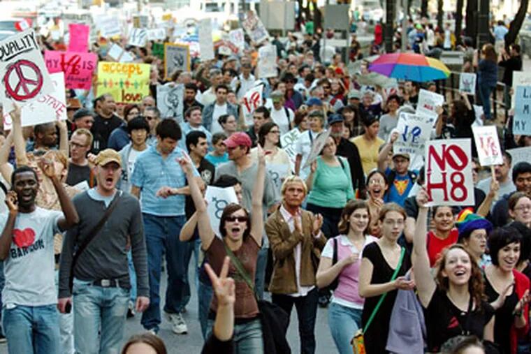 A crowd of several thousand march in the streets around City Hall to protest the passage of California's Proposition 8, which outlawed the marriage of same-sex couples. (Clem Murray / Staff Photographer)