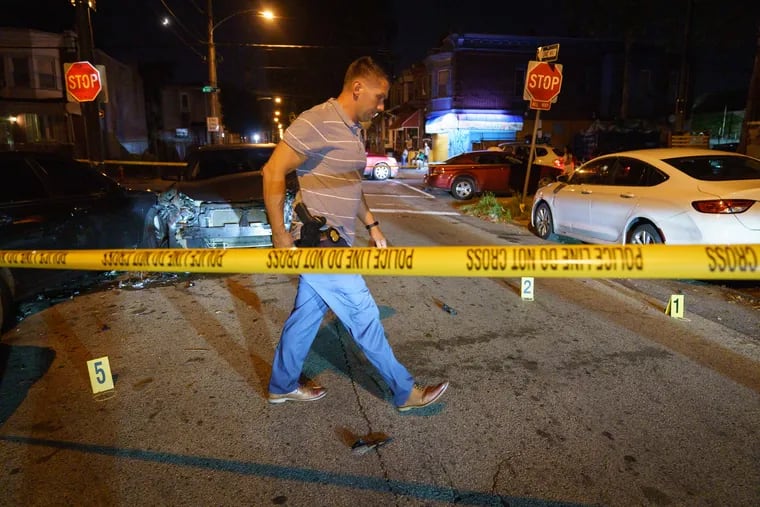 A double shooting at N 15th St & W Courtland St, in Philadelphia, July 14, 2021. Police say two males, a 19-year-old and a 16-year-old, were both shot after being chased by another vehicle in the city's Logan section.