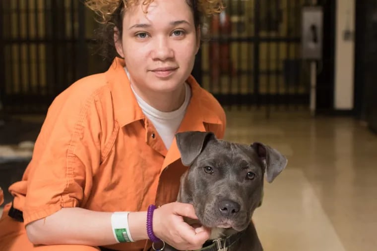 Bryon Murphy and her dog, Olympia, train with New Leash on Life, a Philadelphia nonprofit that teaches inmates dog-training and grooming skills so they can find work once they leave prison.