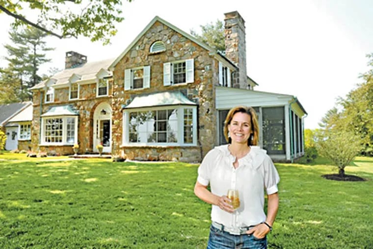 Kathleen Penney stands in front of her newly renovated home in West Chester. (Clem Murray / Staff Photographer)