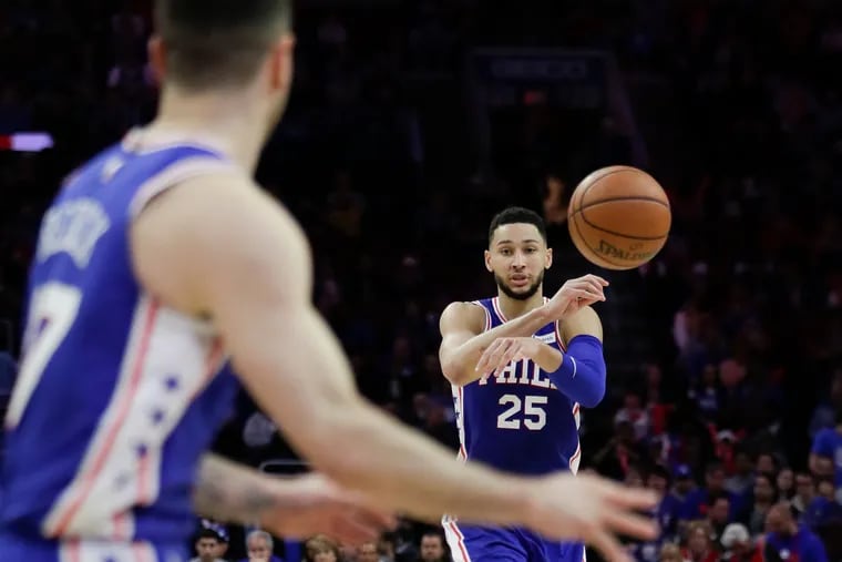 Sixers guard Ben Simmons passes the basketball to teammate guard JJ Redick against the Brooklyn Nets in game two of the Eastern Conference playoffs on Monday, April 15, 2019 in Philadelphia.