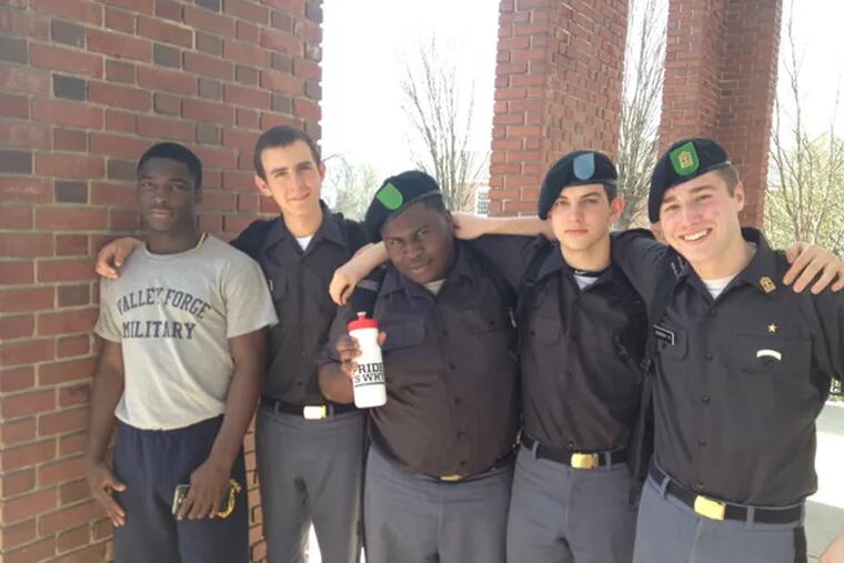 Eddie Michaels, 16, left, poses with other high school students at Valley Forge Military Academy.  (Jessica Parks / Staff)