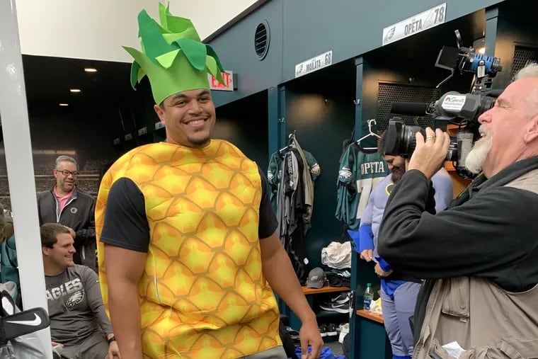Eagles rookie Andre Dillard, at 6-foot-5 and 315 pounds, dressed up as a pineapple to visit children at CHOP before Halloween.