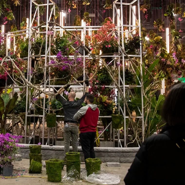 Hanging floral arrangements decorate the entranceway at the PHS Philadelphia Flower Show at the Pennsylvania Convention Center in Philadelphia, Pa. on Monday, February 27, 2023. The Flower Show opens on March 4 and runs through March 12.