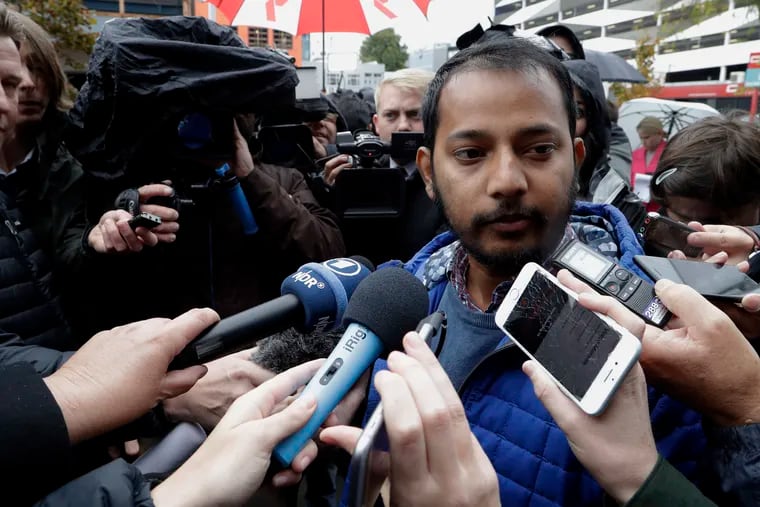 Tofazzal Alam, a survivor of the Linwood Mosque shootings, speaks to the media outside the High Court in Christchurch, New Zealand, Friday, April 5, 2019.