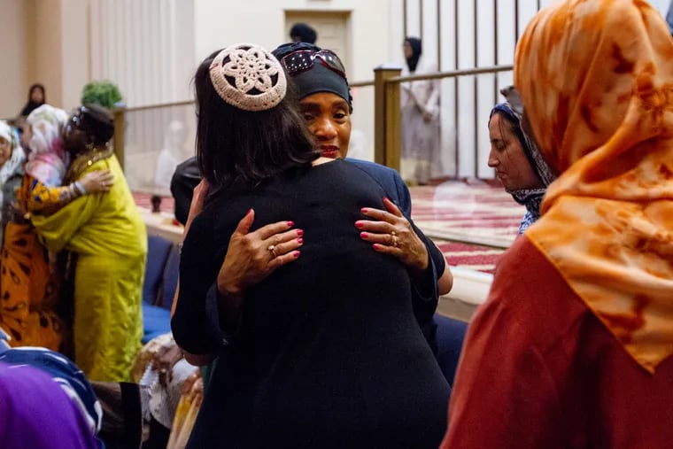 Ayeesha Abdussalaam hugs Rabbi, Leah Berkowitz, during a Jumaa service at the Masjidullah Mosque at the intersection of Washington Lane and Limekiln Avenue in the West Oak Lane neighborhood of Philadelphia March 15, 2019. Jewish attendees mostly from the Board of Rabbis of Greater Philadelphia came in solidarity with Muslims and the victims of the terrorist assault on Christchurch Mosques in New Zeland.