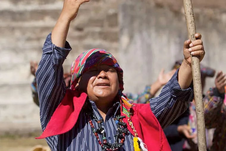 A Mayan priest prays during a ceremony in Guatemala.