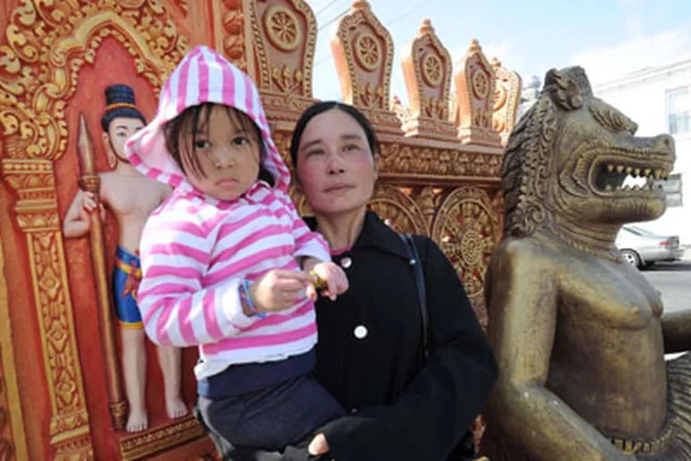 San Dar Htwe with daughter Eint. They fled Burma and found tragedy in South Philadelphia. (April Saul / Staff Photographer)