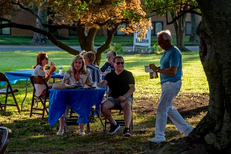 Music lovers attend an "old-fashioned, summer outdoor picnic," under the shade trees outside the Mansion at the Scottish Rite in Collingswood in July. The summer had its share of hot days, but the overnight warmth was more impressive.
