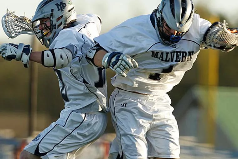 Malvern Prep's Kevin McGeary, left, celebrates with Tommy O'Connor after O'Connor's goal at Malvern High School on Friday, May 3, 2013. (Ron Cortes/Staff Photographer)