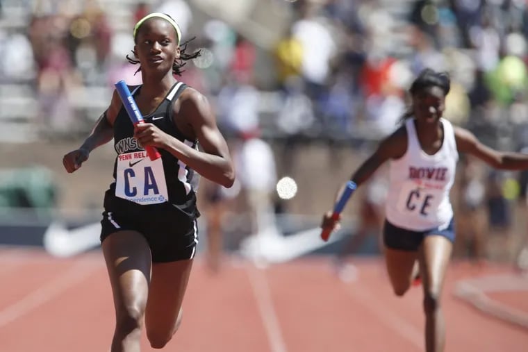 Shakira Dancy (left), of WInslow Township, runs the winning anchor leg in the High School Girls’ 4x100m Relay Championship of America at the 2017 Penn Relays.
