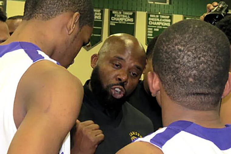 Camden coach Cetshwayo Byrd talks to his team during its Group 3 semifinal game against Neptune. (Marc Narducci/Staff)