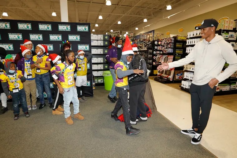Eagles wide receiver DeVonta Smith surprises kids from the Staley Park South Jersey Independent Youth Football Association during a shopping event at Dick's Sports Goods in Cherry Hill, New Jersey on Monday, December 13, 2021.