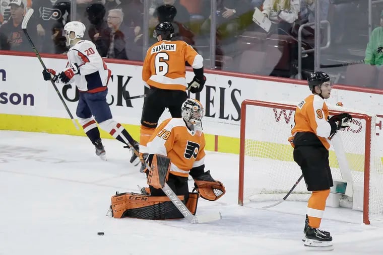 Flyers goalie Carter Hart reacts after allowing the Capitals' second goal on Thursday.