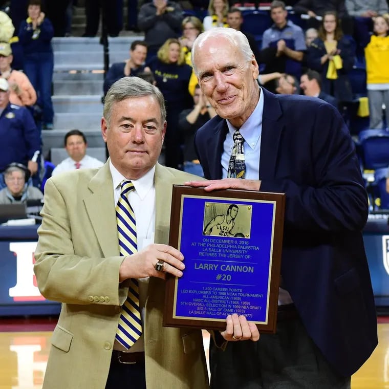 Larry Cannon (right) receives an award from La Salle athletic director Bill Bradshaw.