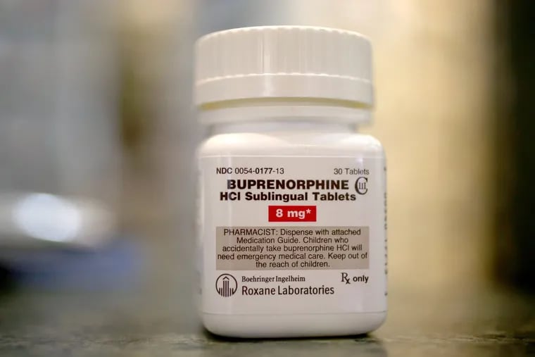 In this photo illustration, a bottle of the generic prescription pain medication Buprenorphine is seen in a pharmacy. As opioid overdose deaths surge, calls are growing to provide it to drug users. (Joe Raedle/Getty Images/TNS)