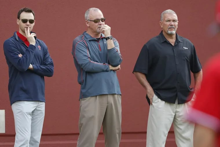 Phillies general manager Matt Klentak (left) and director of player development Joe Jordan (center) face a long-term absence from one of their top draft picks last summer.