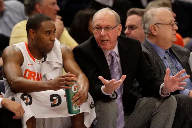 Syracuse head coach Jim Boeheim talks with Scoop Jardine during the first half of an NCAA college basketball game against Connecticut at the Big East Championship Friday, March 11, 2011, in New York. (AP Photo/Frank Franklin II)