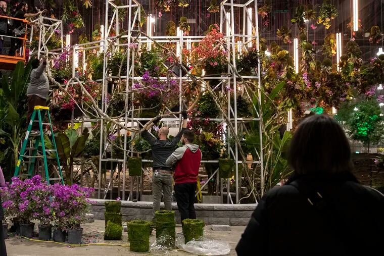 Hanging floral arrangements decorate the entranceway at the PHS Philadelphia Flower Show at the Pennsylvania Convention Center in Philadelphia, Pa. on Monday, February 27, 2023. The Flower Show opens on March 4 and runs through March 12.